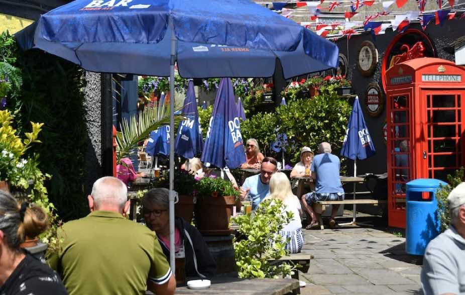 sunny spacious beer garden with outside bar at Tenby House. Pembrokeshire